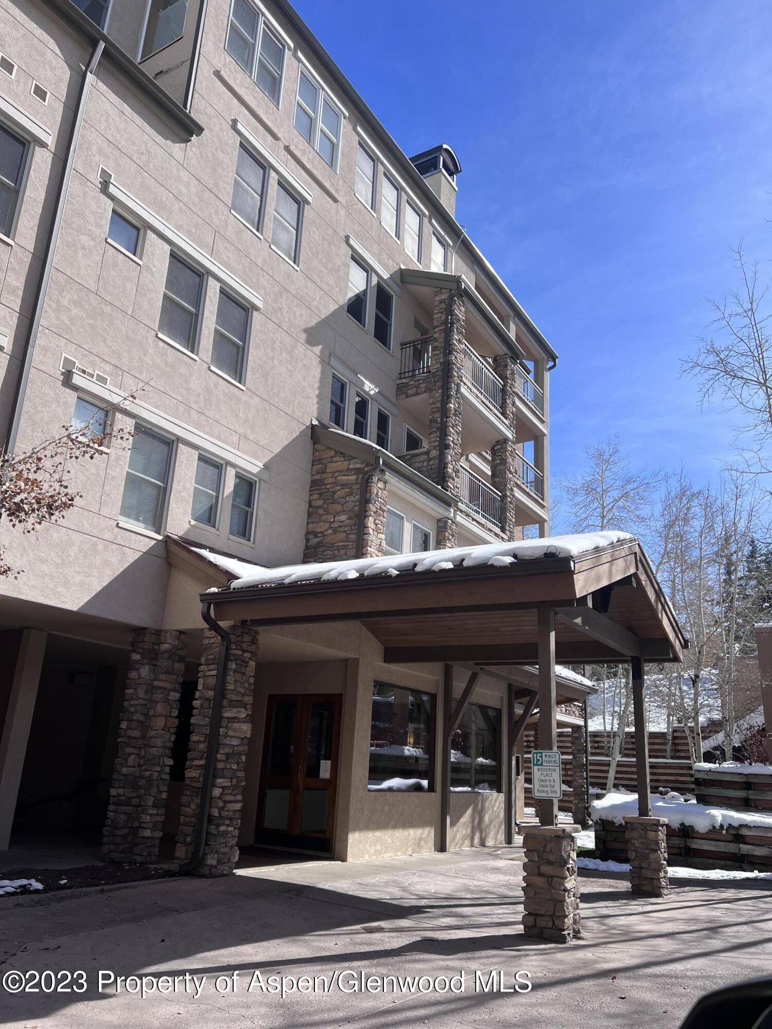425 Wood Road, Unit 6 Snowmass Village, CO 81615 - Photo 26 of 29 a view of a building with a street