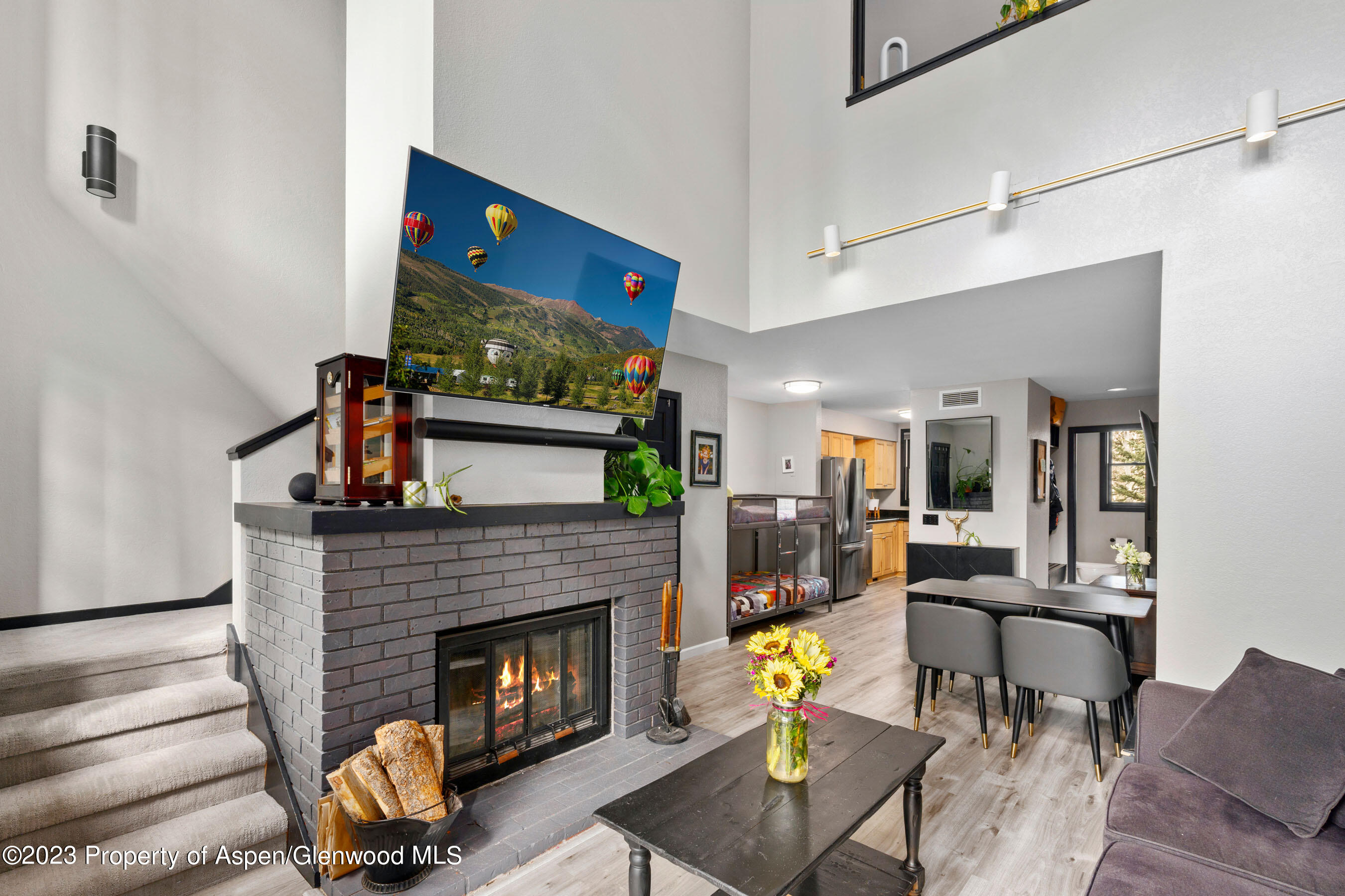 425 Wood Road, Unit 6 Snowmass Village, CO 81615 - Photo 7 of 29 a living room with furniture and a fireplace