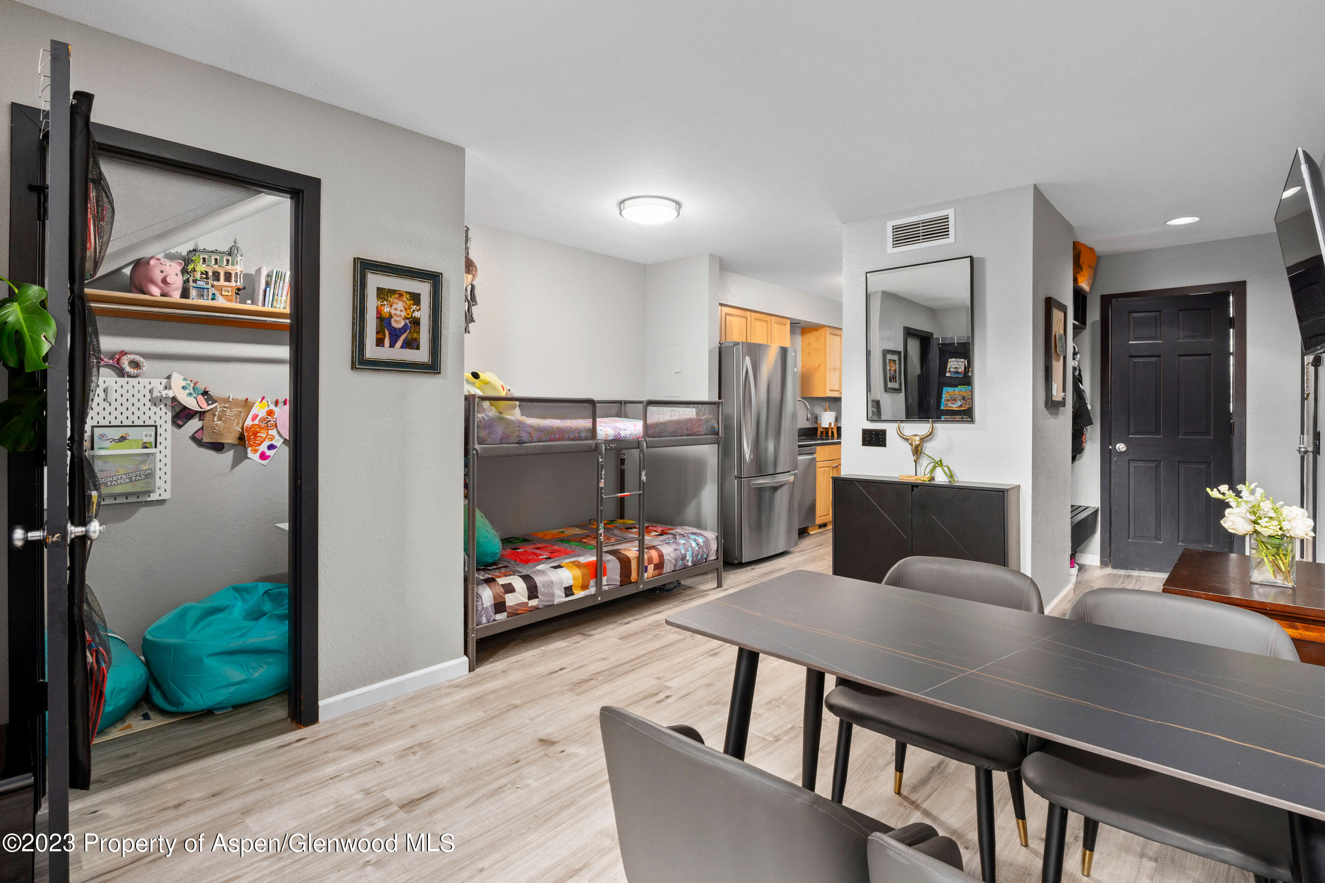 425 Wood Road, Unit 6 Snowmass Village, CO 81615 - Photo 9 of 29 a view of a dining room with furniture and a livingroom