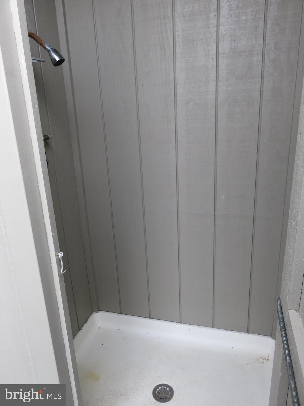 0 Pilot Point, Unit 22A Lewes, DE 19958 - Photo 17 of 42 Outdoor shower off of screened porch