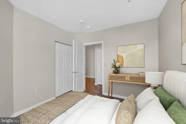a bedroom with a bed and a couch