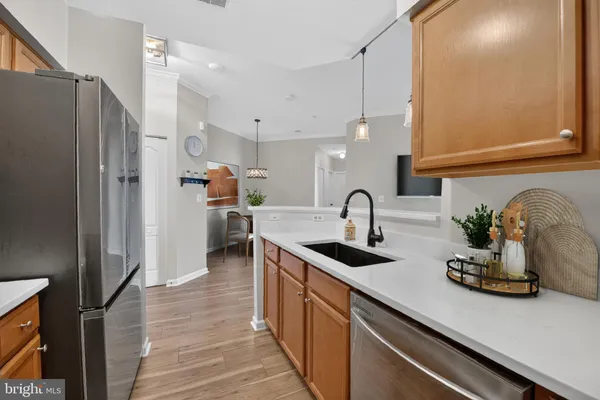 a kitchen with refrigerator and cabinets