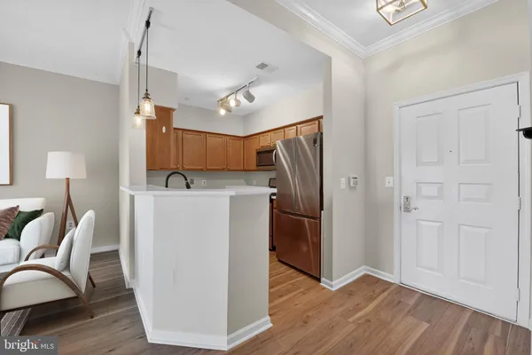 a view of kitchen with furniture wooden floor and window