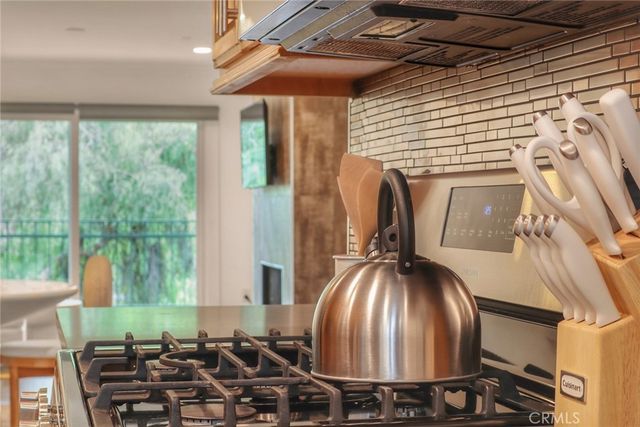 a room with lots of trees and furniture