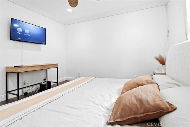 a bedroom with a bed and a lamp on table