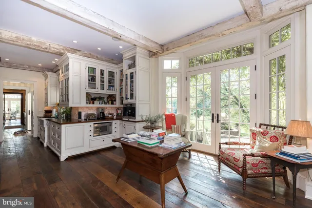 a kitchen with lots of counter top space and wooden floor