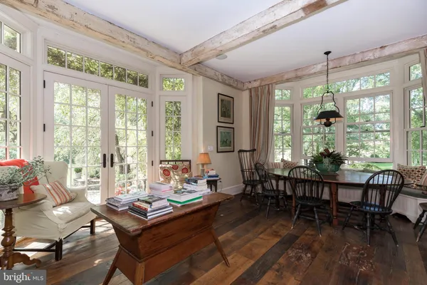 a view of a dining room with furniture window and outside view