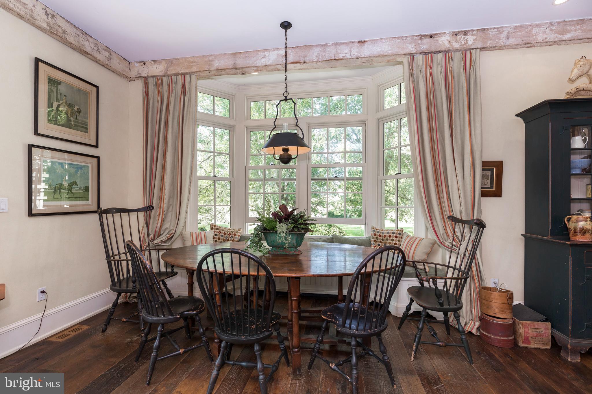 380 Upland Road Kennett Square, PA 19348 - Photo 13 of 106 a view of a dining room with furniture window and wooden floor