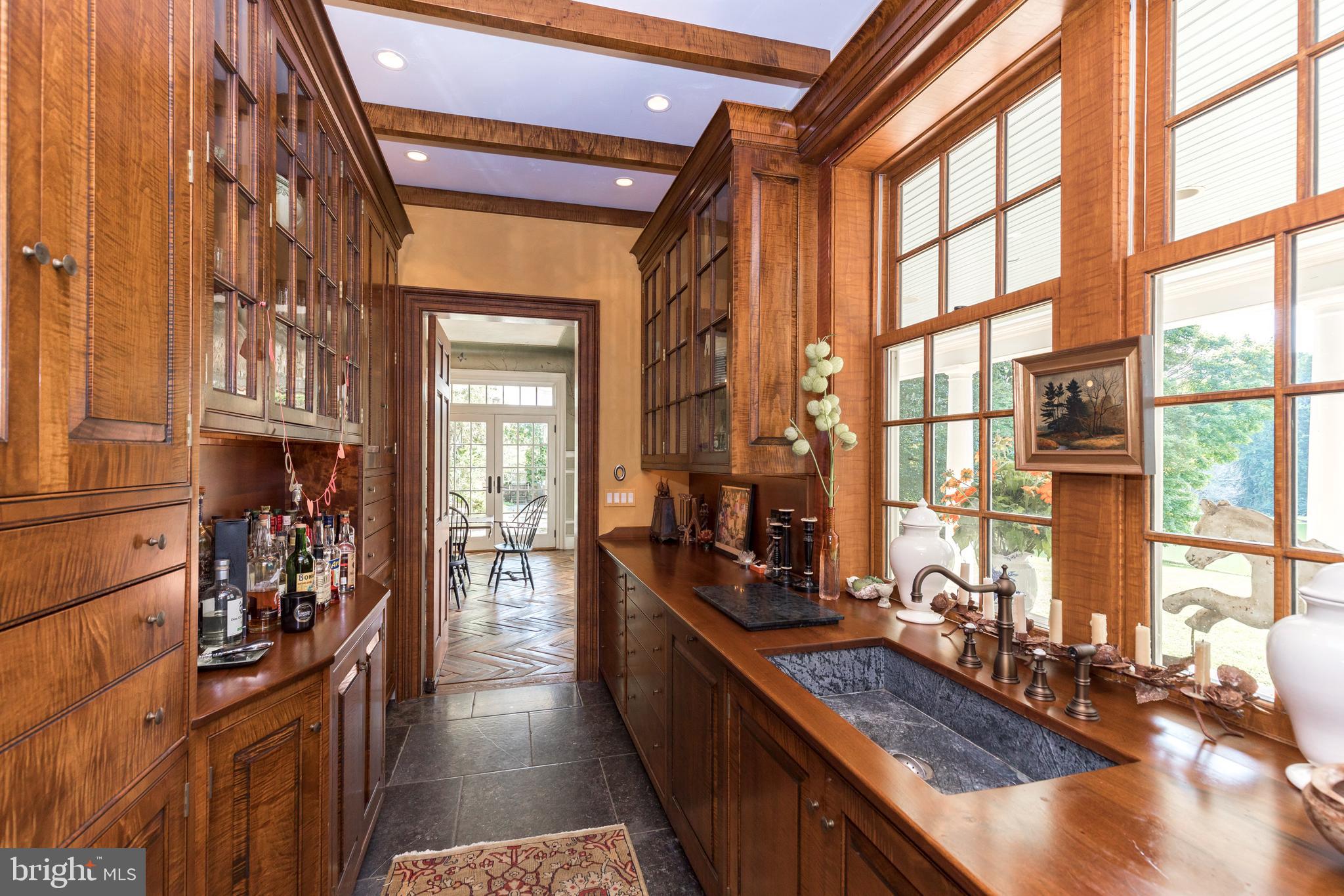 380 Upland Road Kennett Square, PA 19348 - Photo 15 of 106 a kitchen with lots of counter top space and wooden floor