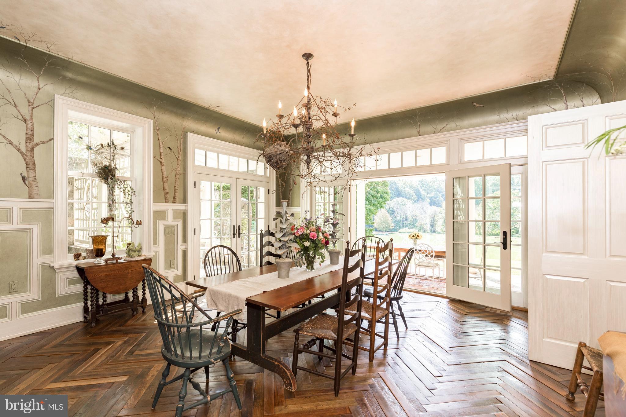 380 Upland Road Kennett Square, PA 19348 - Photo 19 of 106 a view of a dining room with furniture wooden floor and chandelier