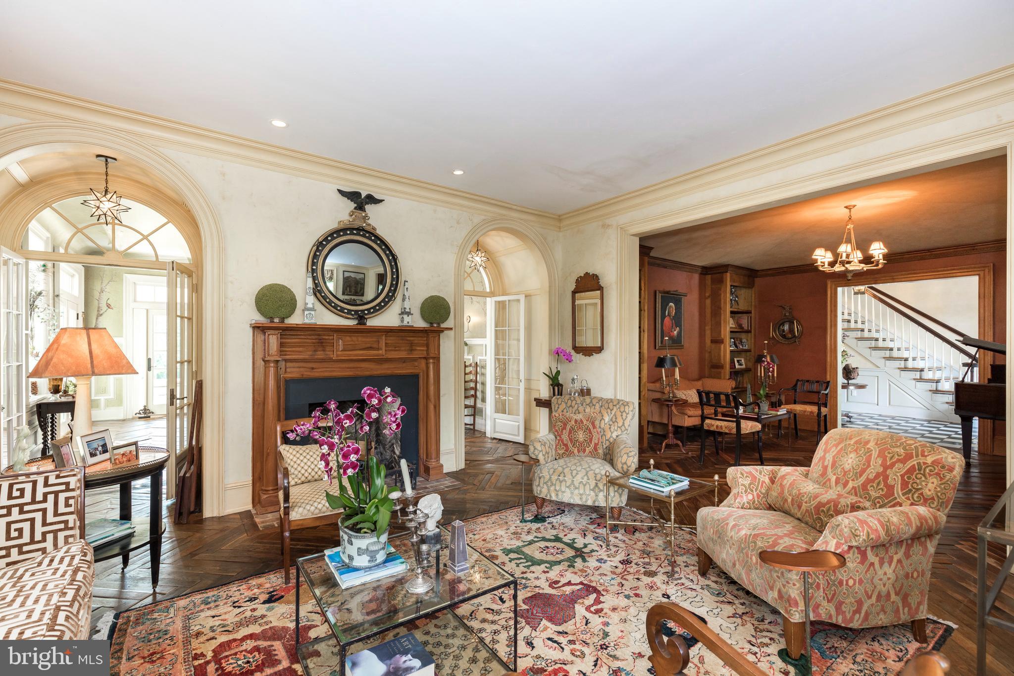 380 Upland Road Kennett Square, PA 19348 - Photo 23 of 106 a living room with furniture a fireplace and a chandelier