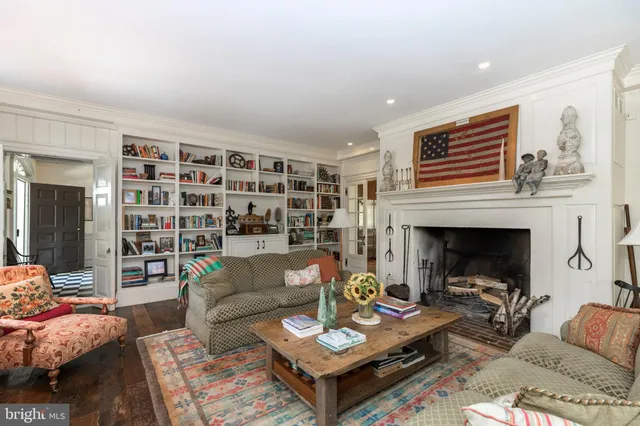 a view of a balcony with wooden floor and iron fence
