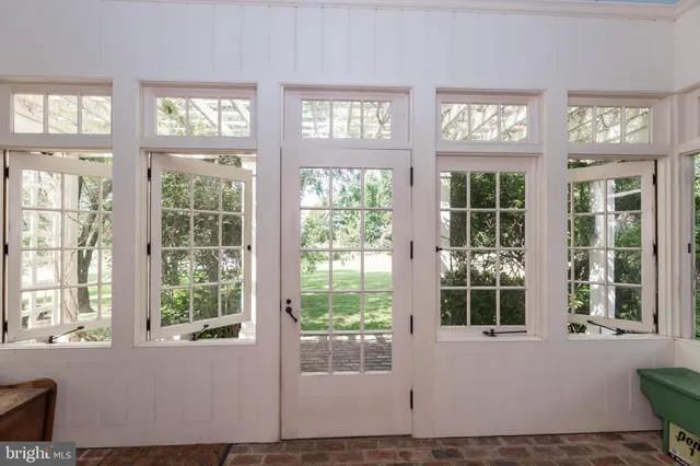 a living room with furniture window and a flat screen tv