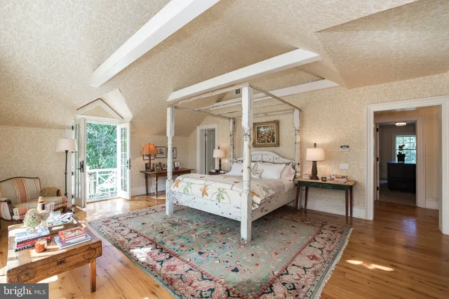 a bedroom with a bed and a chair