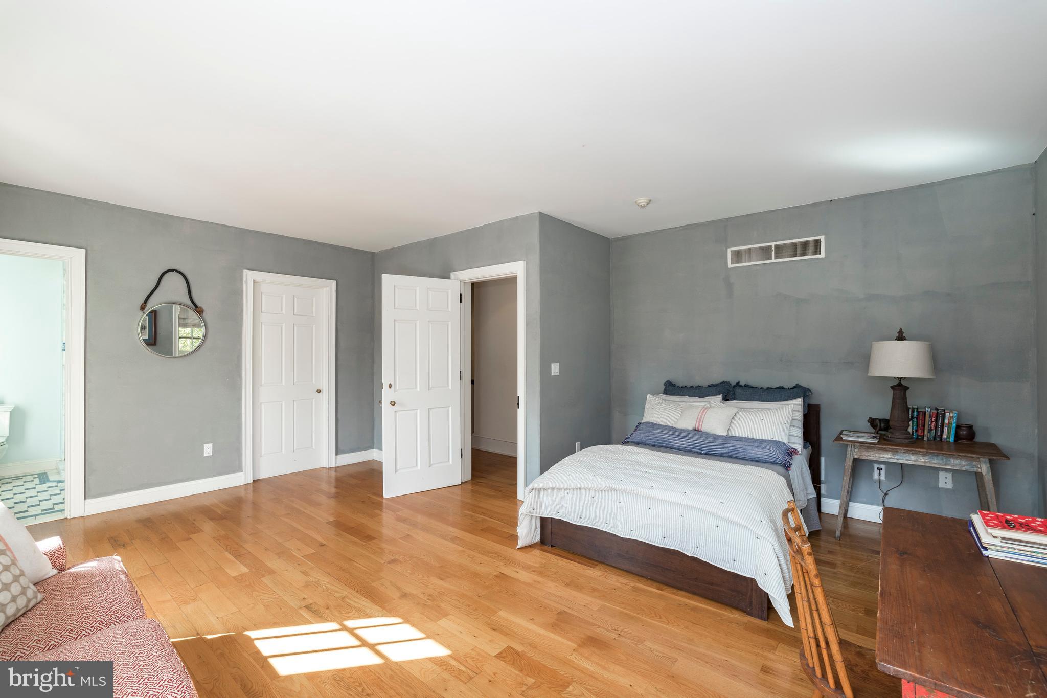 380 Upland Road Kennett Square, PA 19348 - Photo 53 of 106 a bedroom with a bed and a table in it