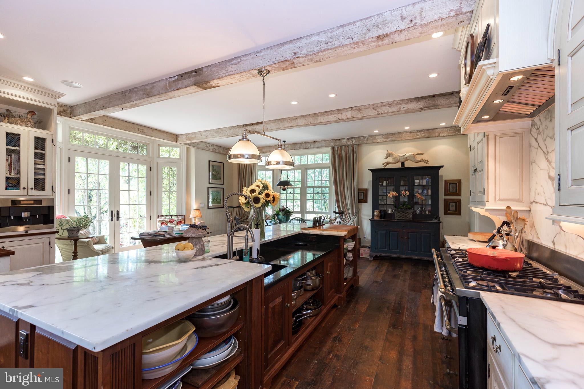 380 Upland Road Kennett Square, PA 19348 - Photo 7 of 106 a kitchen with stainless steel appliances granite countertop a sink counter space and living room view