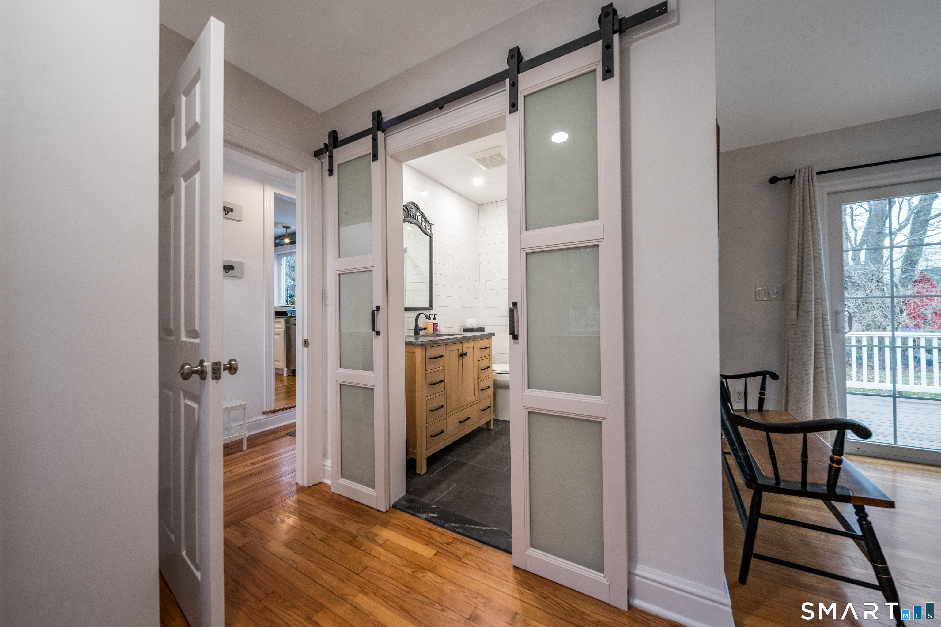 99 Bay View Avenue Groton, CT 06355 - Photo 17 of 70 a bathroom with a glass shower door and a window