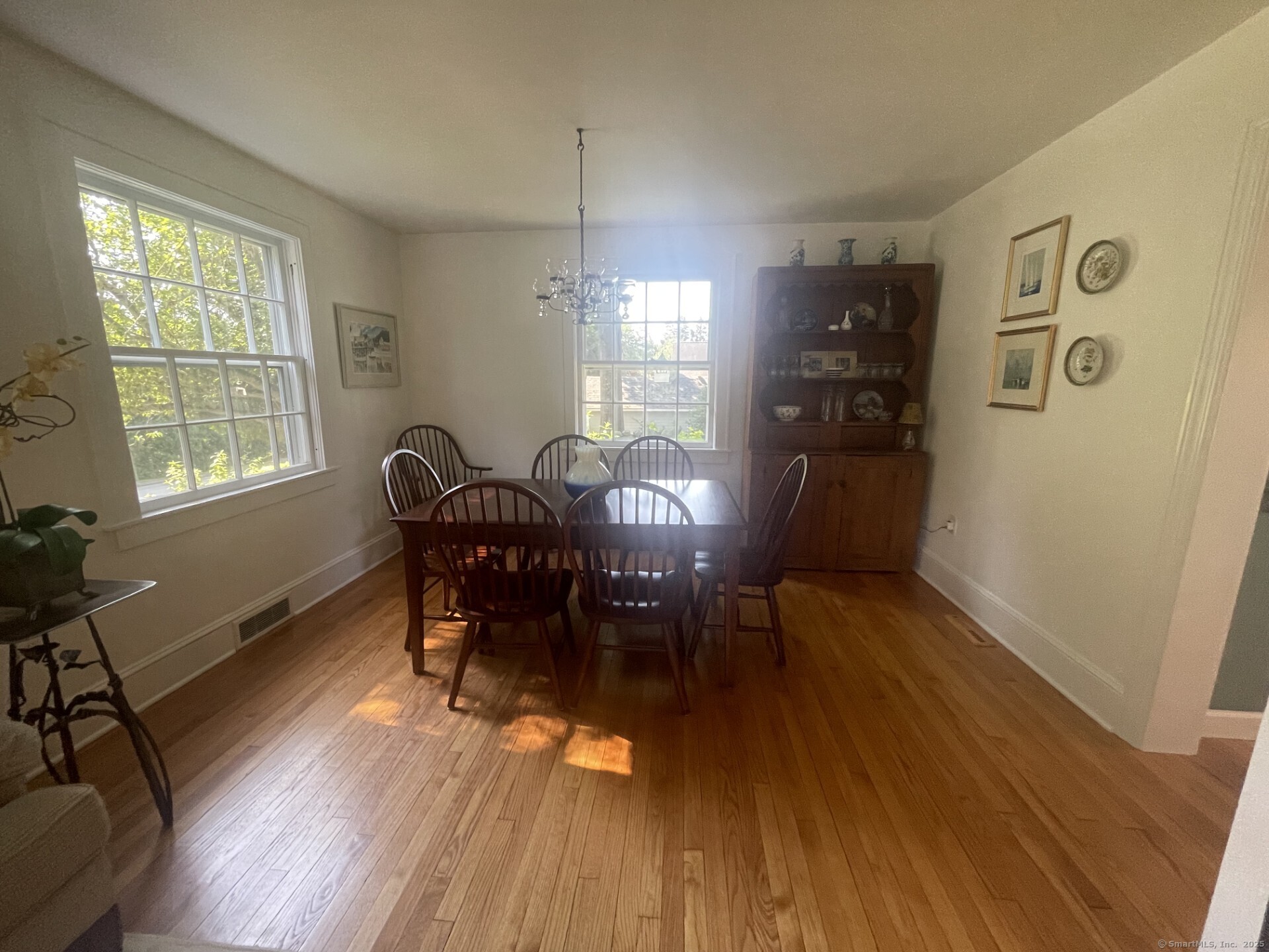 99 Bay View Avenue Groton, CT 06355 - Photo 19 of 34 a view of a dining room with furniture window and wooden floor