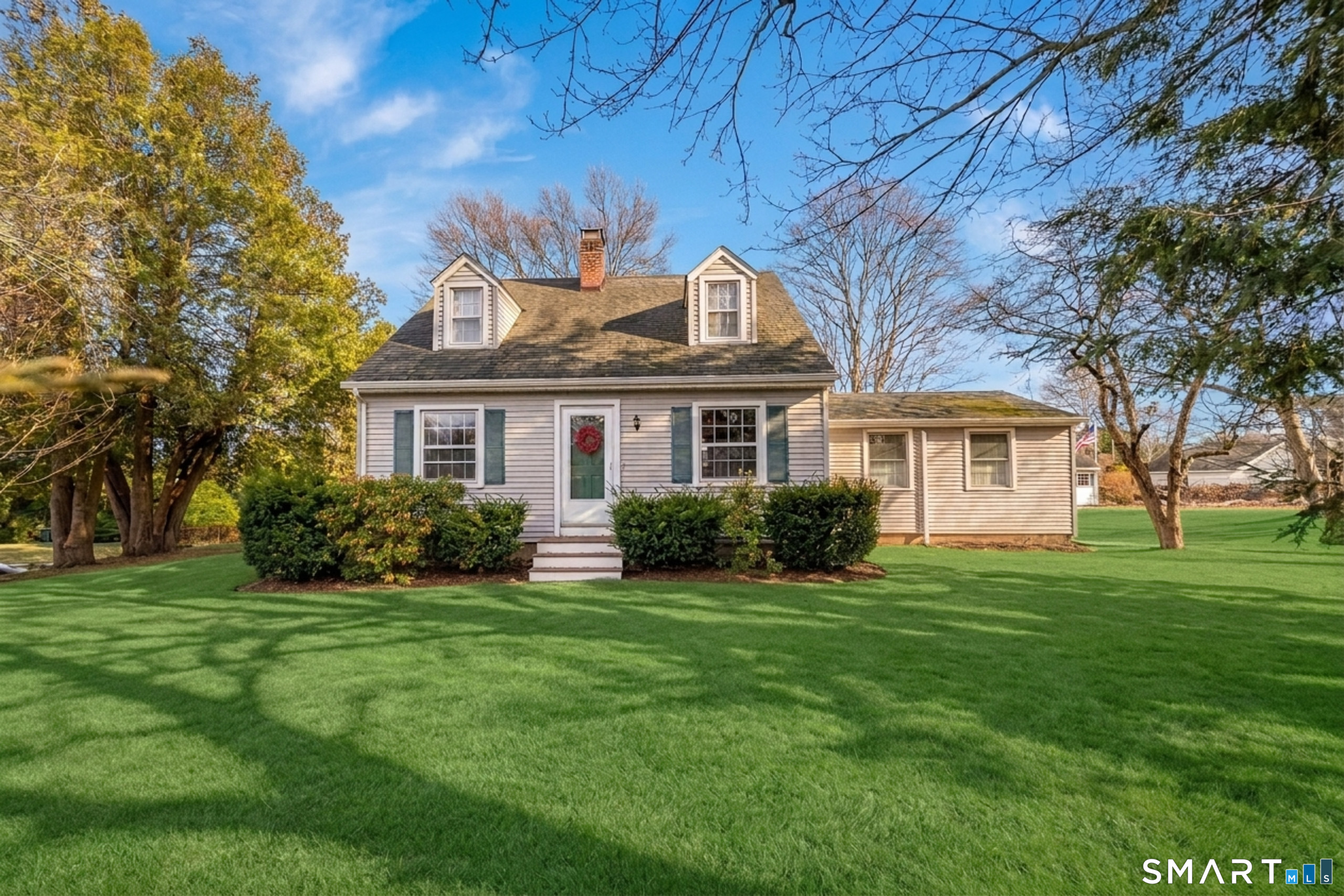99 Bay View Avenue Groton, CT 06355 - Photo 3 of 70 a front view of a house with a garden