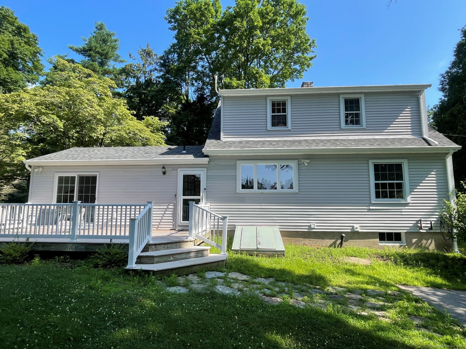 99 Bay View Avenue Groton, CT 06355 - Photo 3 of 34 a front view of a house with a yard