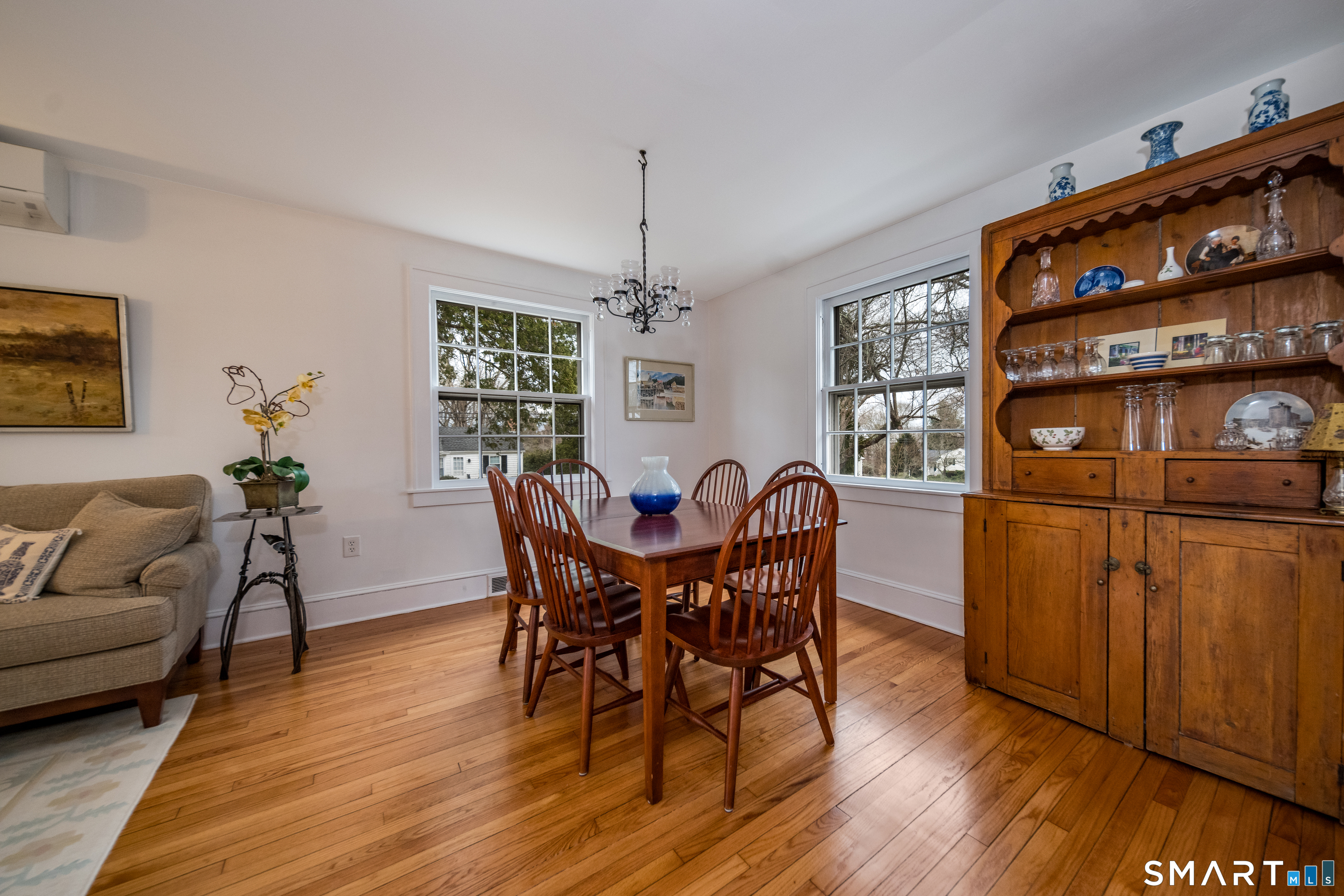99 Bay View Avenue Groton, CT 06355 - Photo 35 of 70 a view of a dining room with furniture and wooden floor