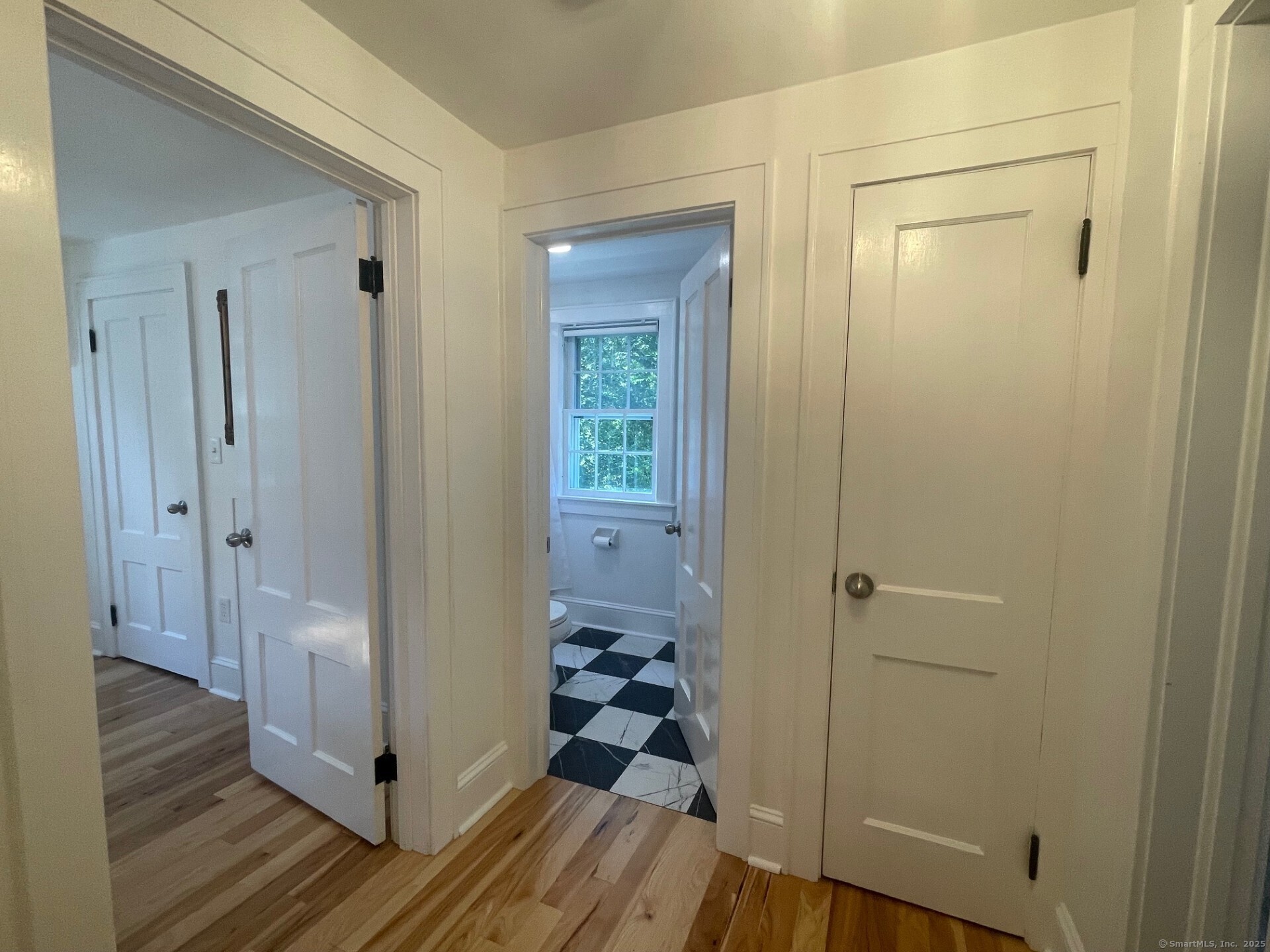 99 Bay View Avenue Groton, CT 06355 - Photo 50 of 70 a view of a hallway view with wooden floor and staircase