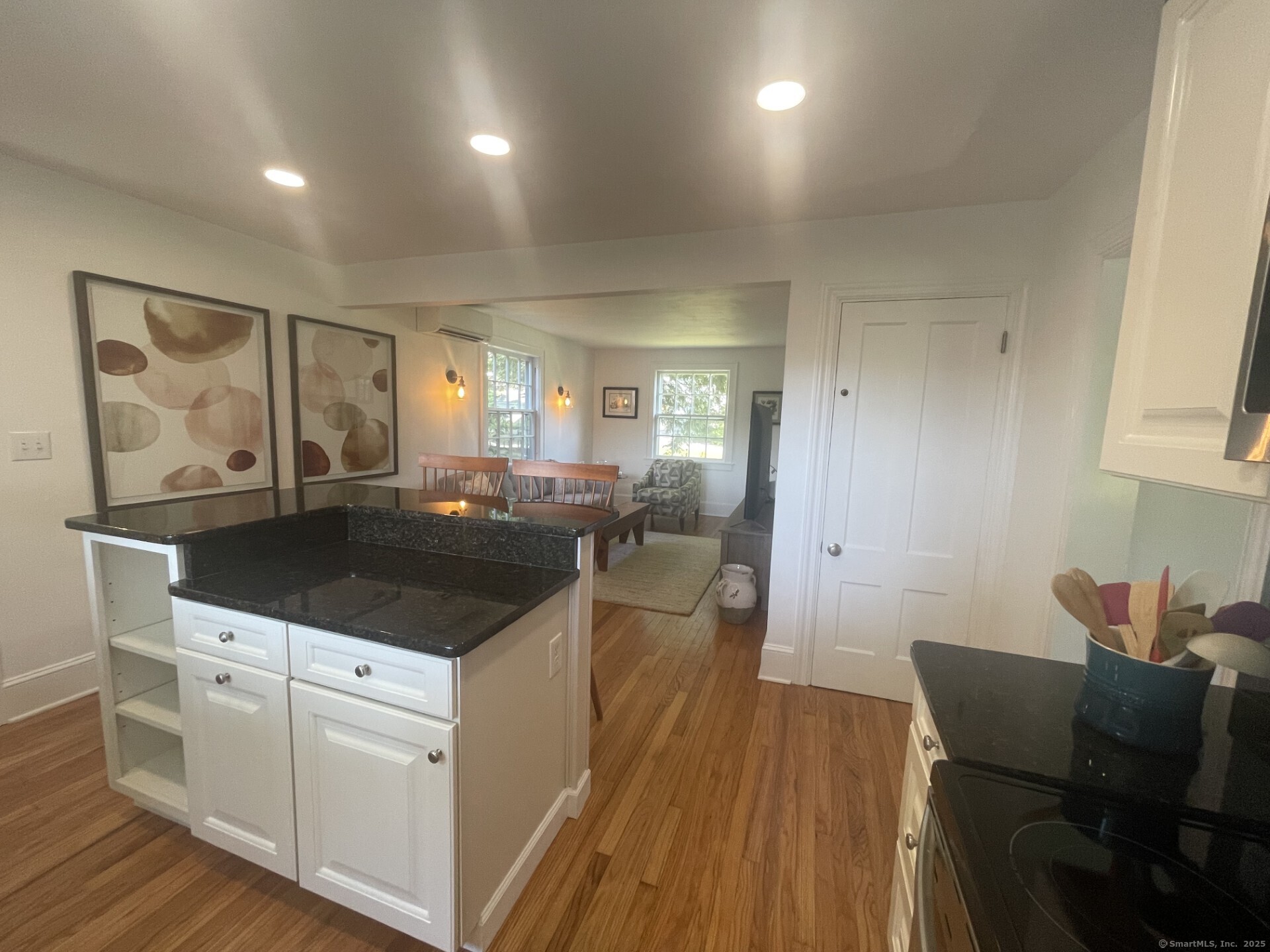 99 Bay View Avenue Groton, CT 06355 - Photo 10 of 34 a kitchen with a sink and chairs