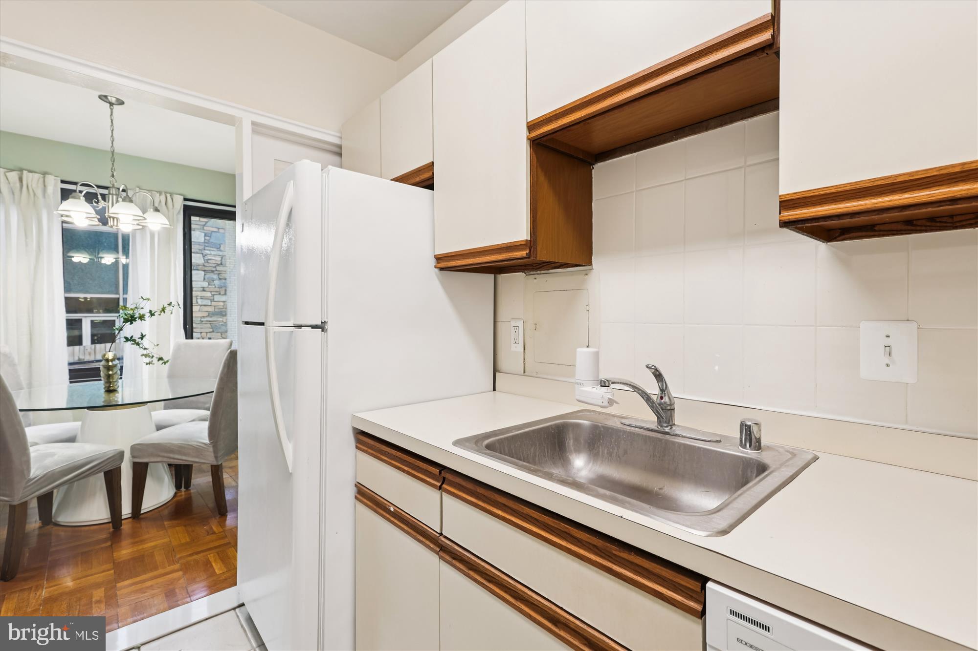 3601 Wisconsin Avenue Northwest, Unit 111 Washington, DC 20016 - Photo 15 of 82 a kitchen with stainless steel appliances granite countertop a sink refrigerator and cabinets