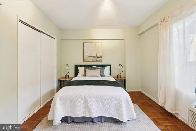 a spacious bedroom with a bed and a walk in closet