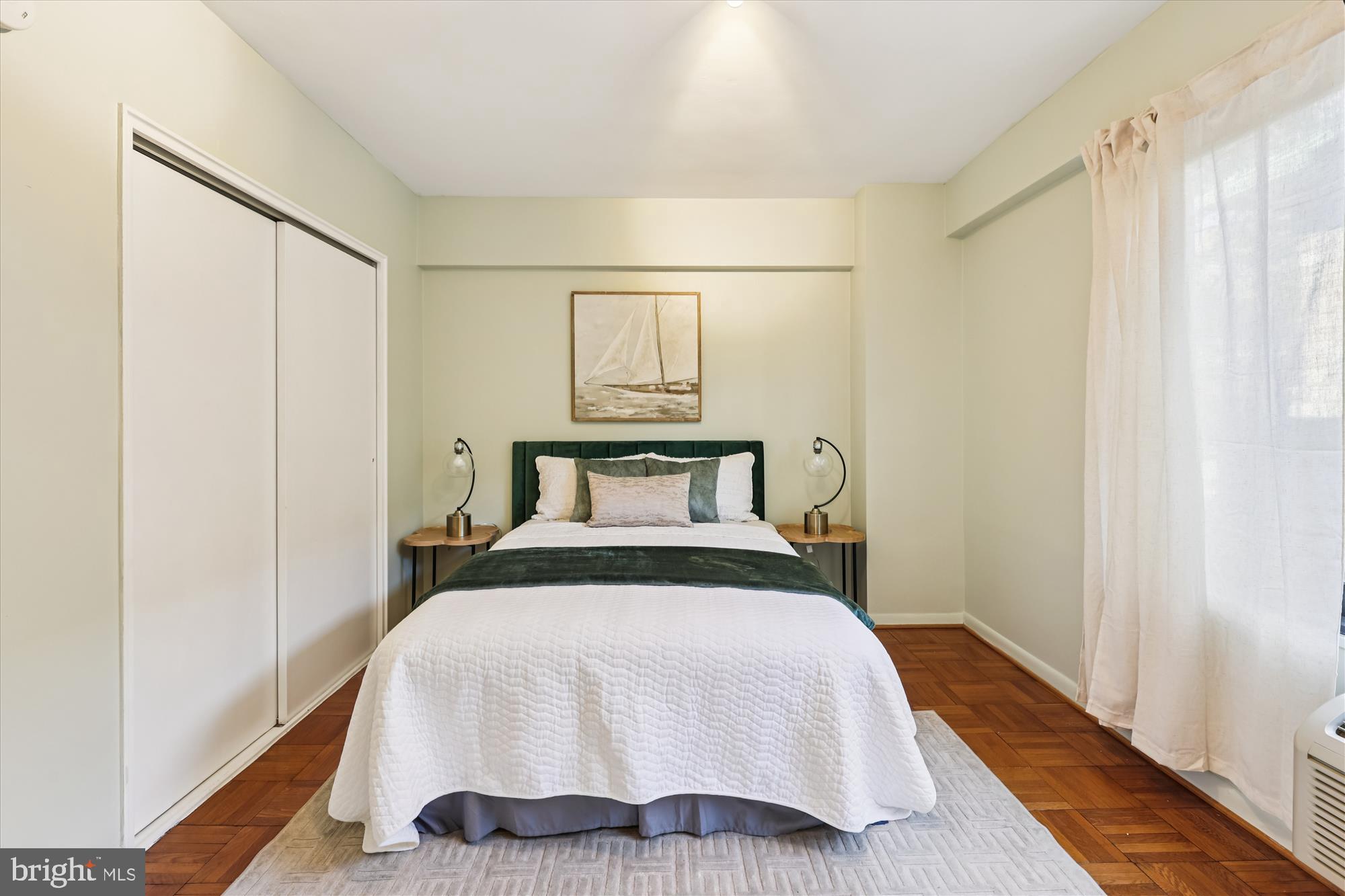 3601 Wisconsin Avenue Northwest, Unit 111 Washington, DC 20016 - Photo 18 of 82 a bedroom with a bed and wooden floor