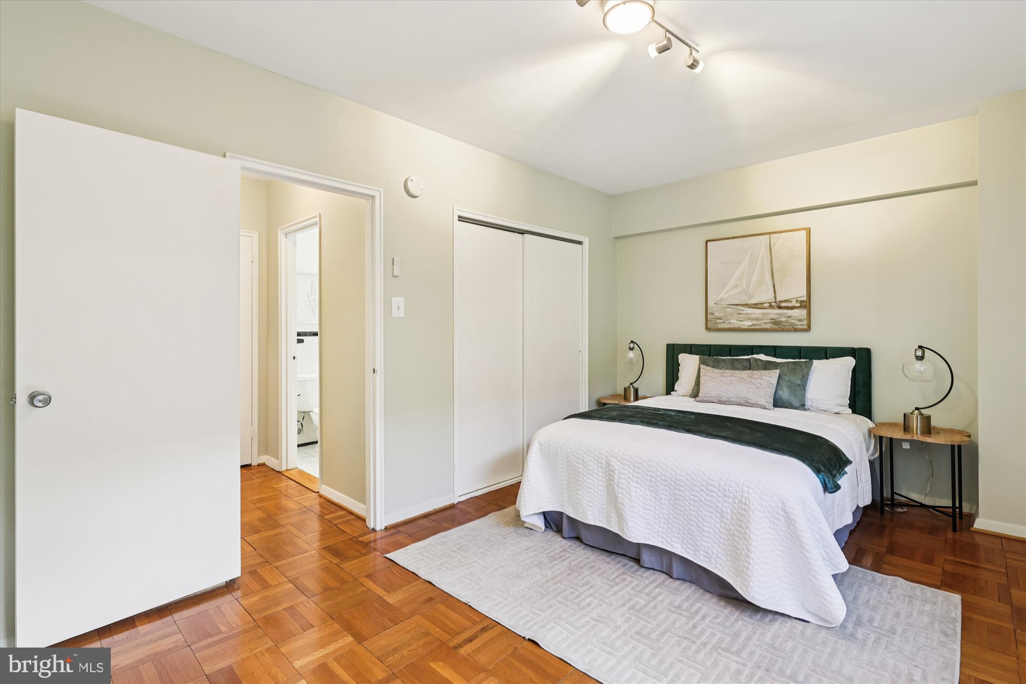 3601 Wisconsin Avenue Northwest, Unit 111 Washington, DC 20016 - Photo 19 of 82 a spacious bedroom with a bed and a walk in closet