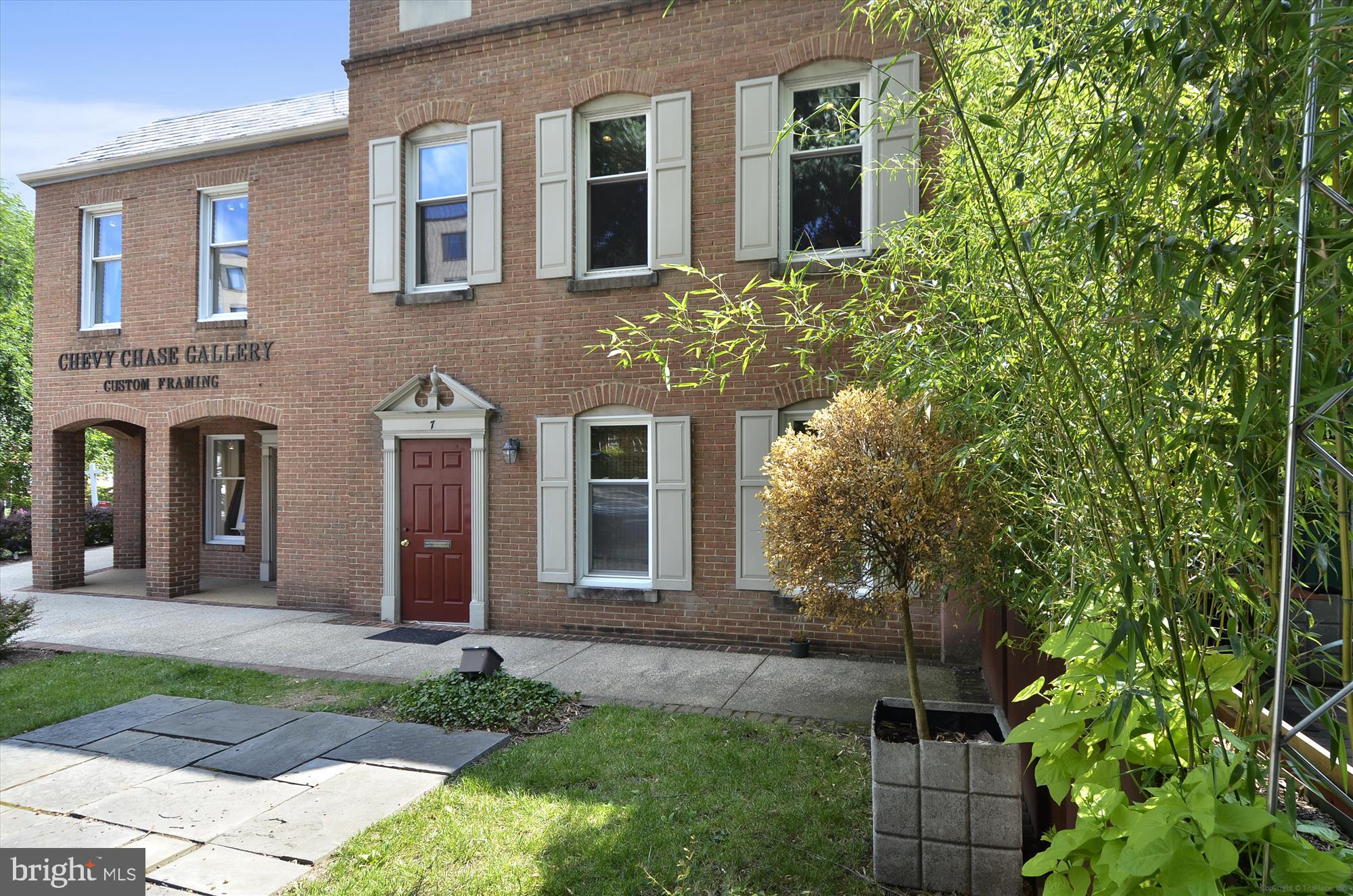 3601 Wisconsin Avenue Northwest, Unit 111 Washington, DC 20016 - Photo 77 of 82 a view of a brick house with many windows and plants