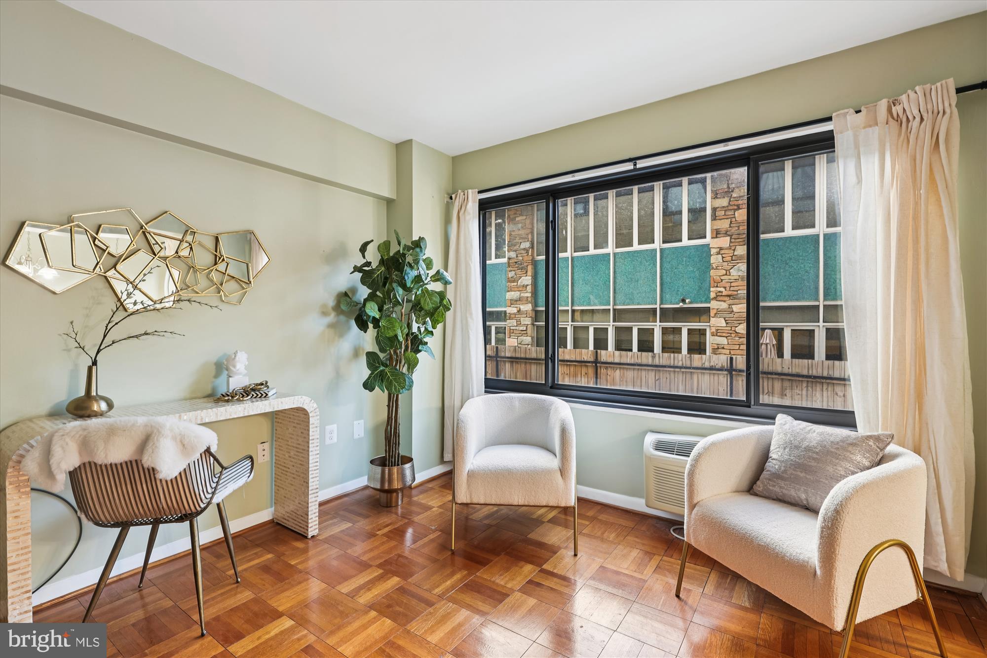 3601 Wisconsin Avenue Northwest, Unit 111 Washington, DC 20016 - Photo 9 of 82 a living room with furniture and a large window