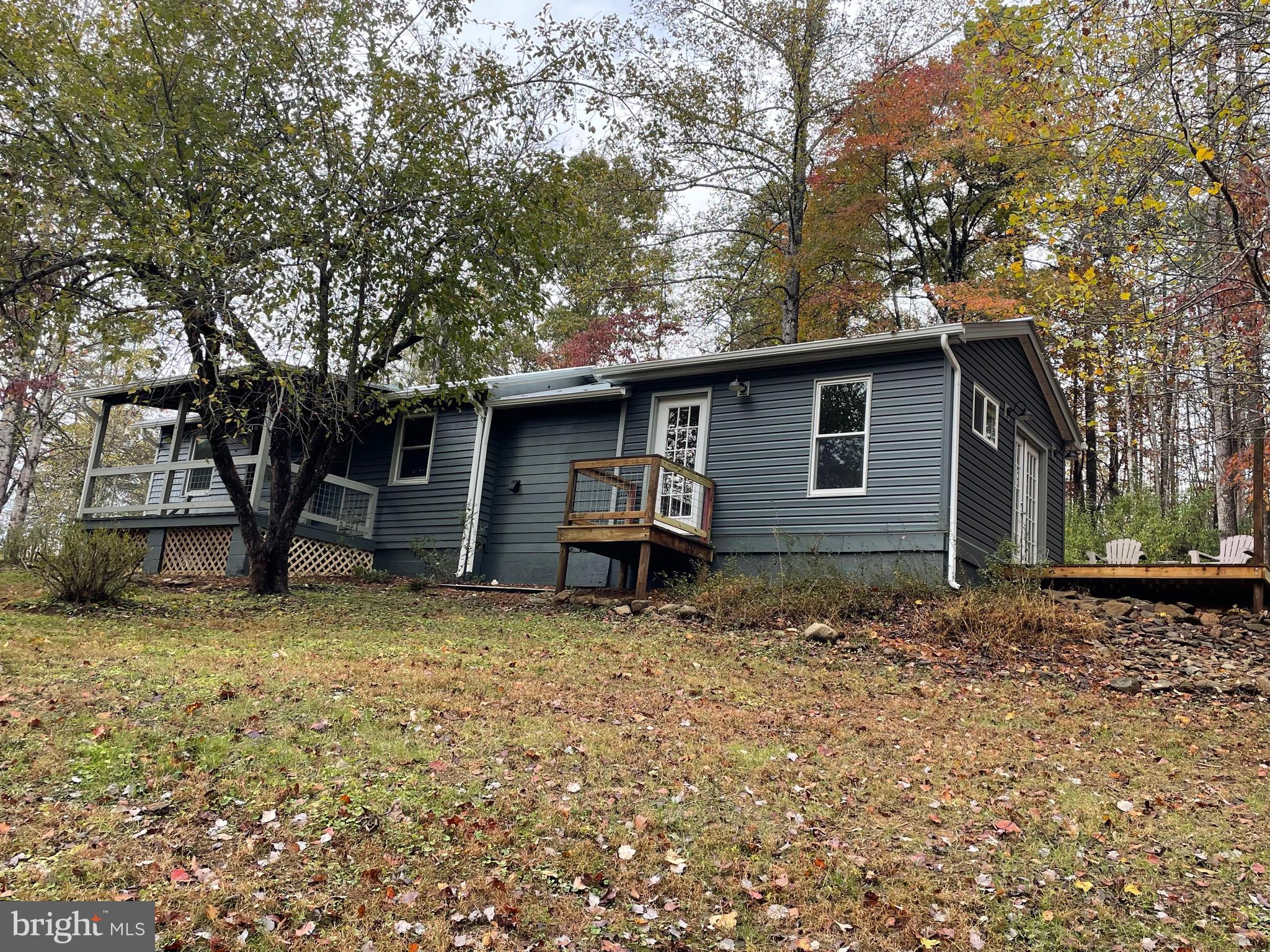 240 Whorton Hollow Road Castleton, VA 22716 - Photo 20 of 37 a house with trees in the background