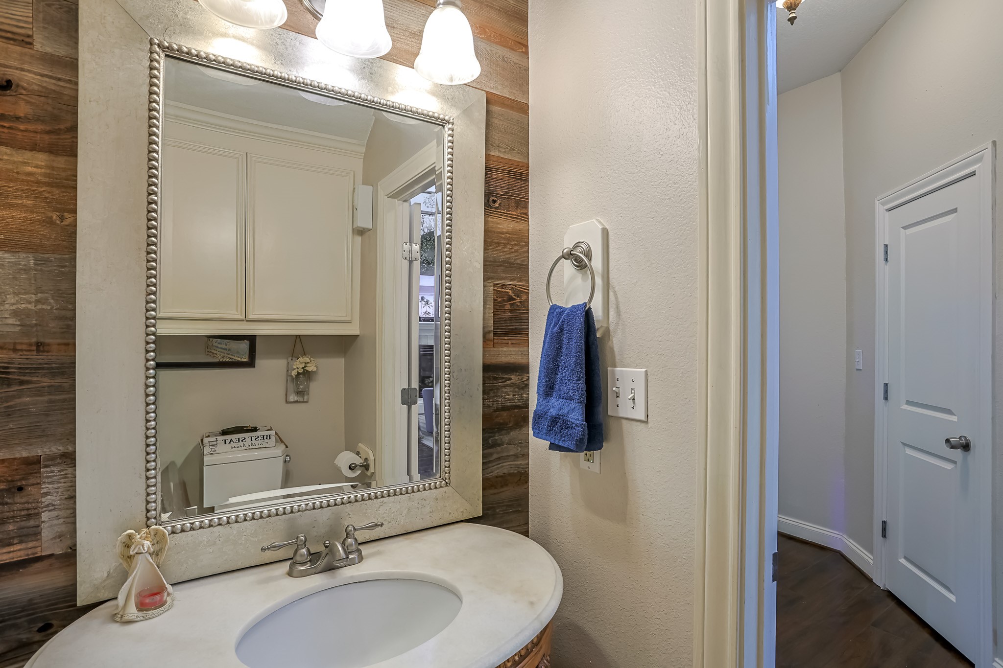 30119 West Geneva Drive Spring, TX 77386 - Photo 14 of 35 Charming powder room with a furniture-style vanity, marble top, and designer lighting