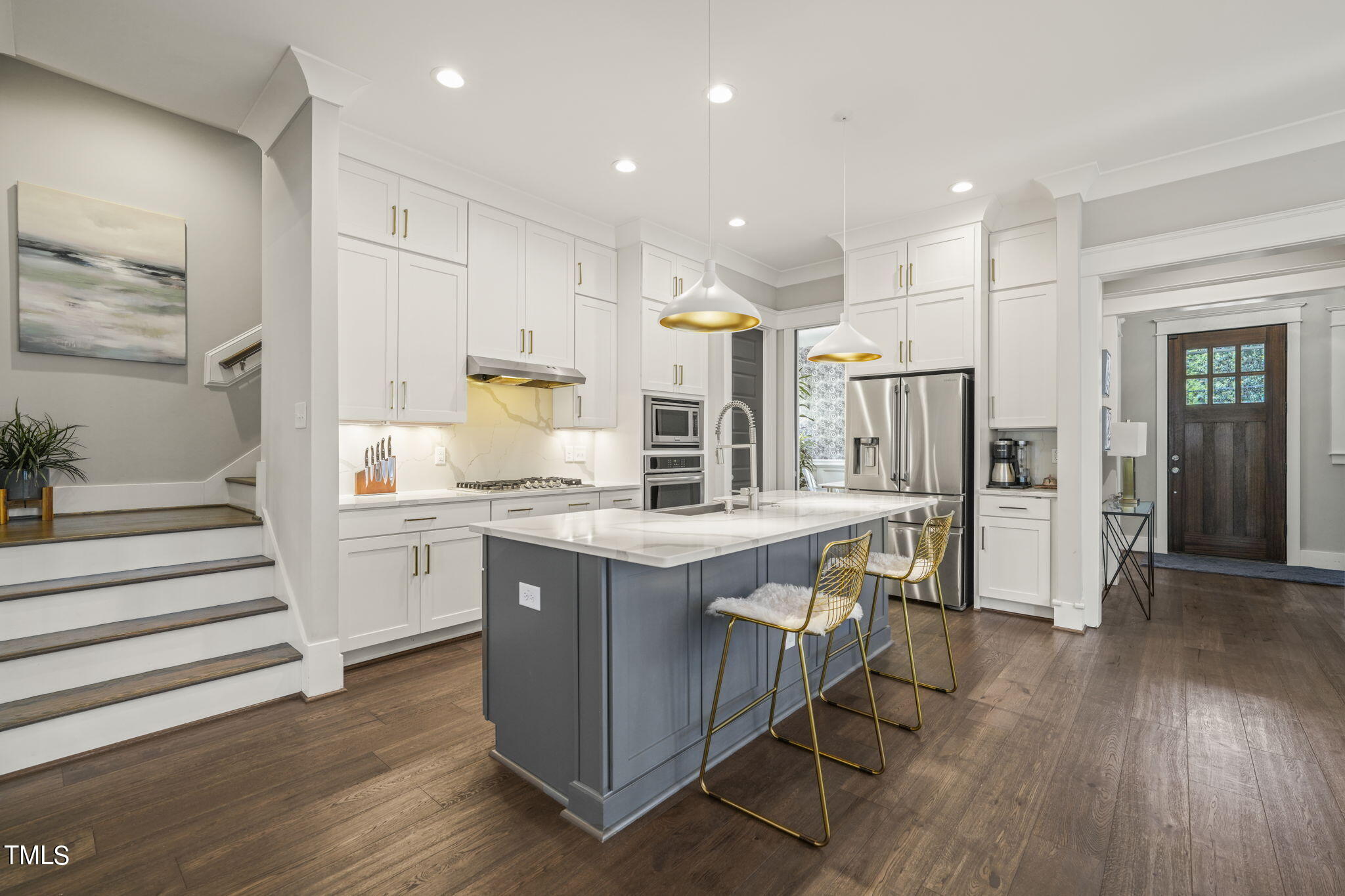 713 Sasser Street Raleigh, NC 27604 - Photo 5 of 66 a kitchen with stainless steel appliances granite countertop a stove and a refrigerator