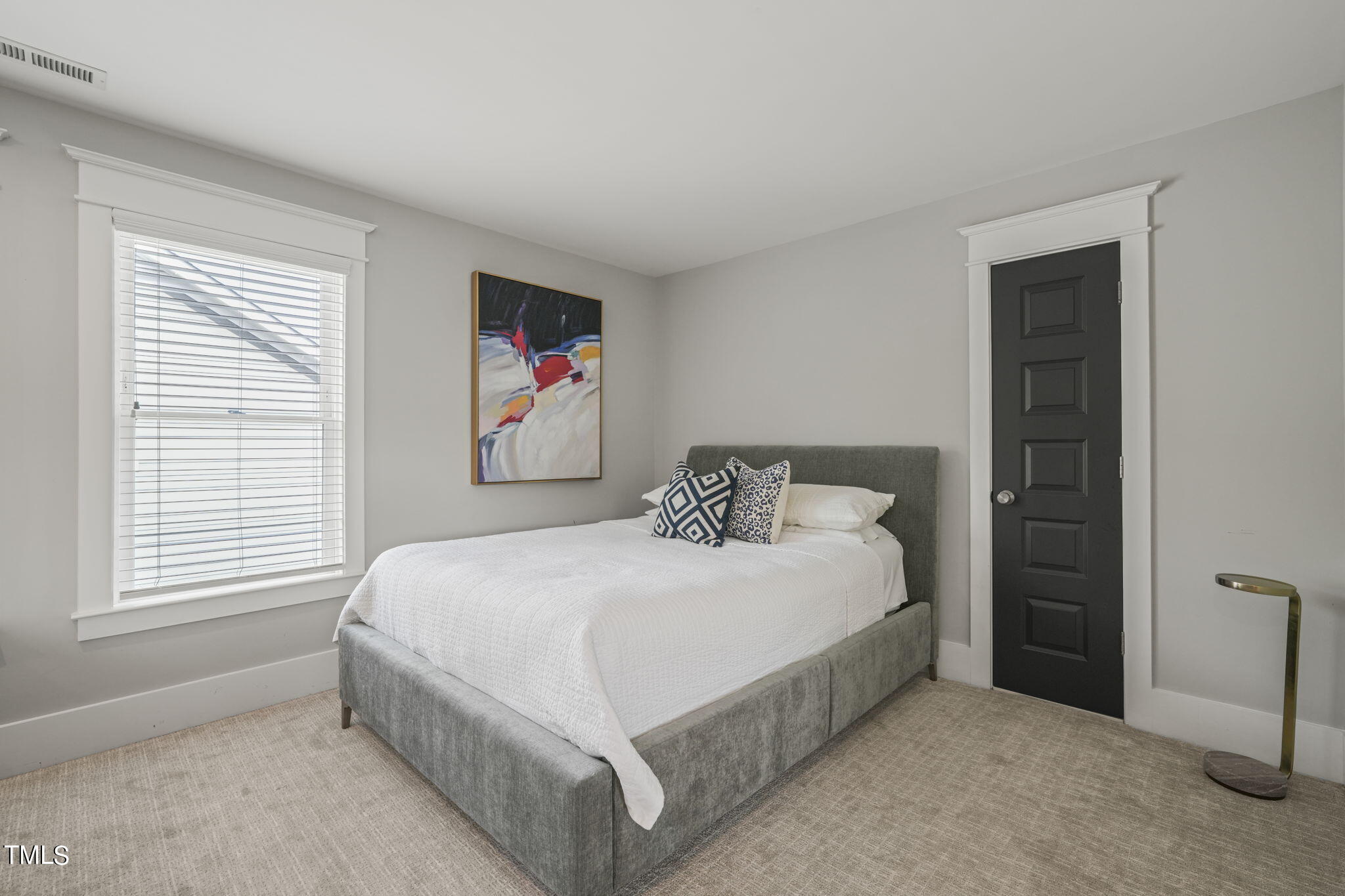 713 Sasser Street Raleigh, NC 27604 - Photo 54 of 66 a bedroom with a large bed and a window