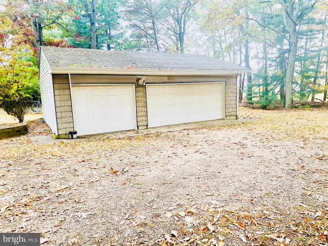 a view of yellow house with a outdoor space