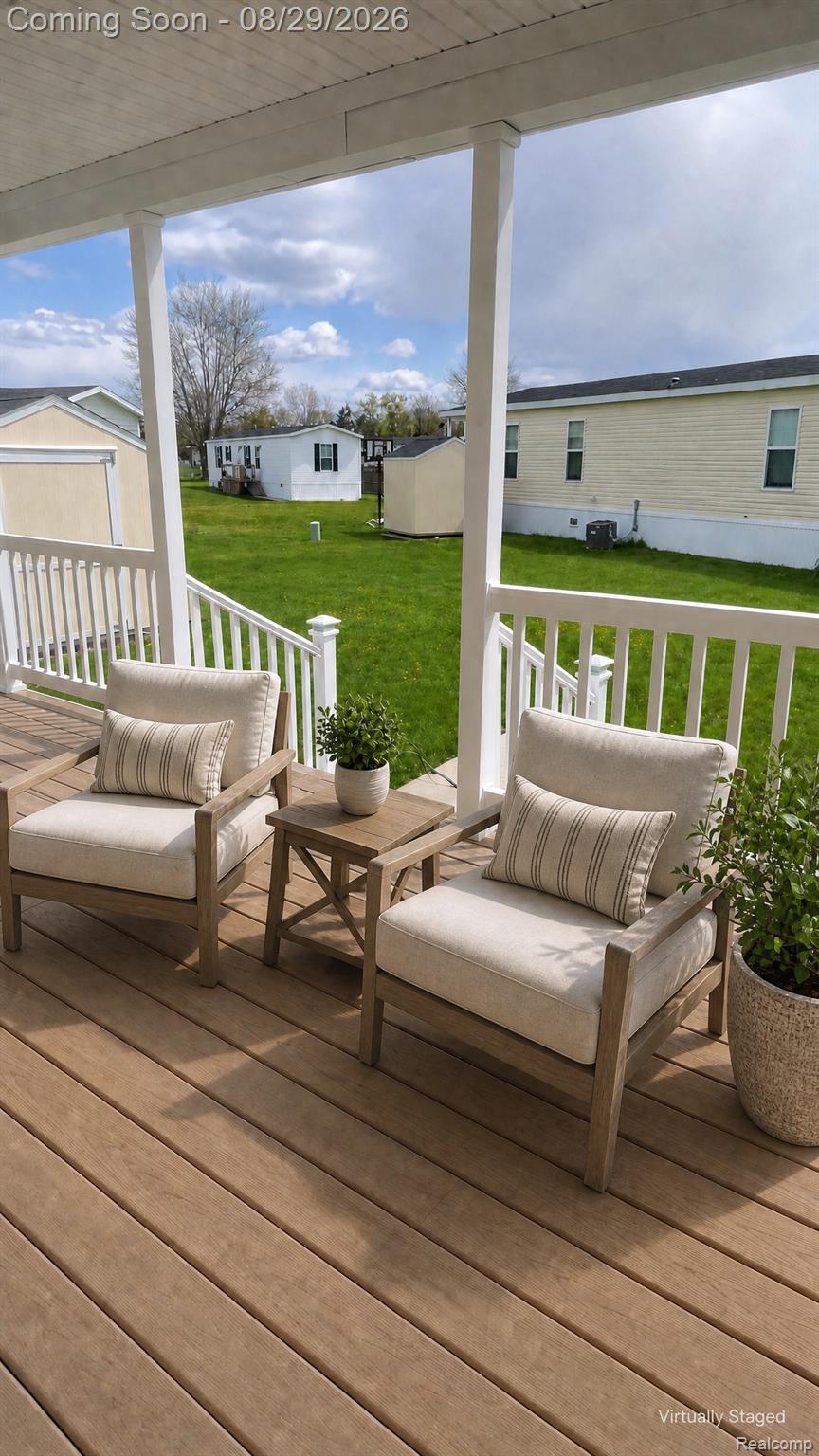 46000 Geddes Road, Unit 520 Canton, MI 48188 - Photo 29 of 29 Expansive covered porch featuring a wood-finish deck and white railing