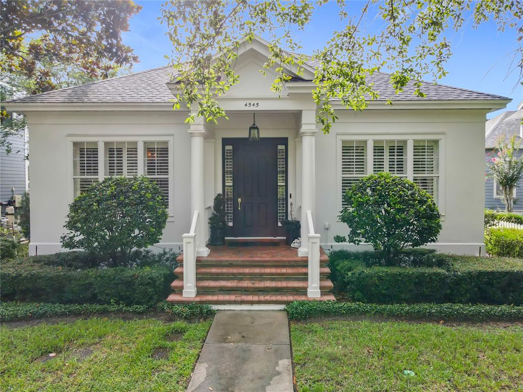 4545 Fox Street Orlando, FL 32814 - Photo 1 of 1 a front view of a house with garden