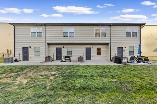 an aerial view of a house with sitting area
