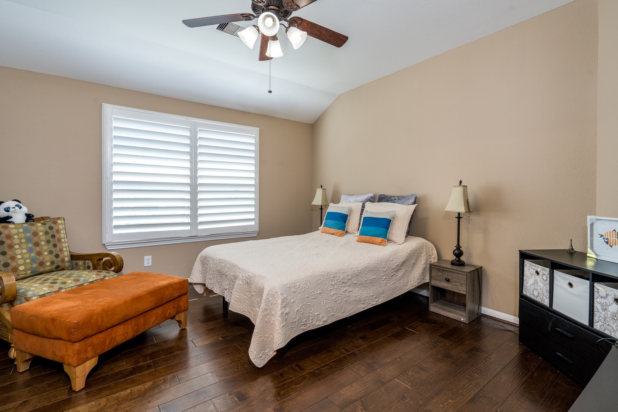9115 Monarch Mist Lane Houston, TX 77070 - Photo 15 of 26 a bedroom with a bed and a chandelier