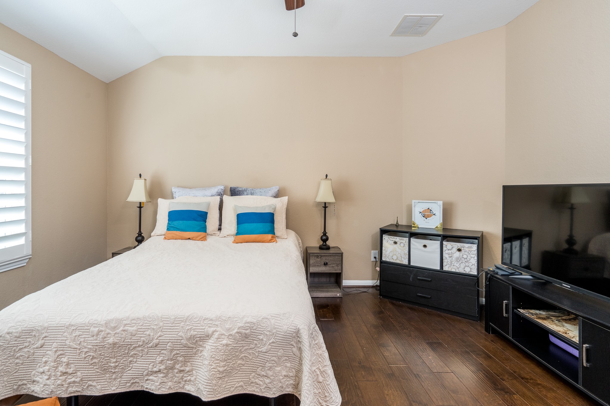 9115 Monarch Mist Lane Houston, TX 77070 - Photo 16 of 26 a bedroom with a bed and a tv in it