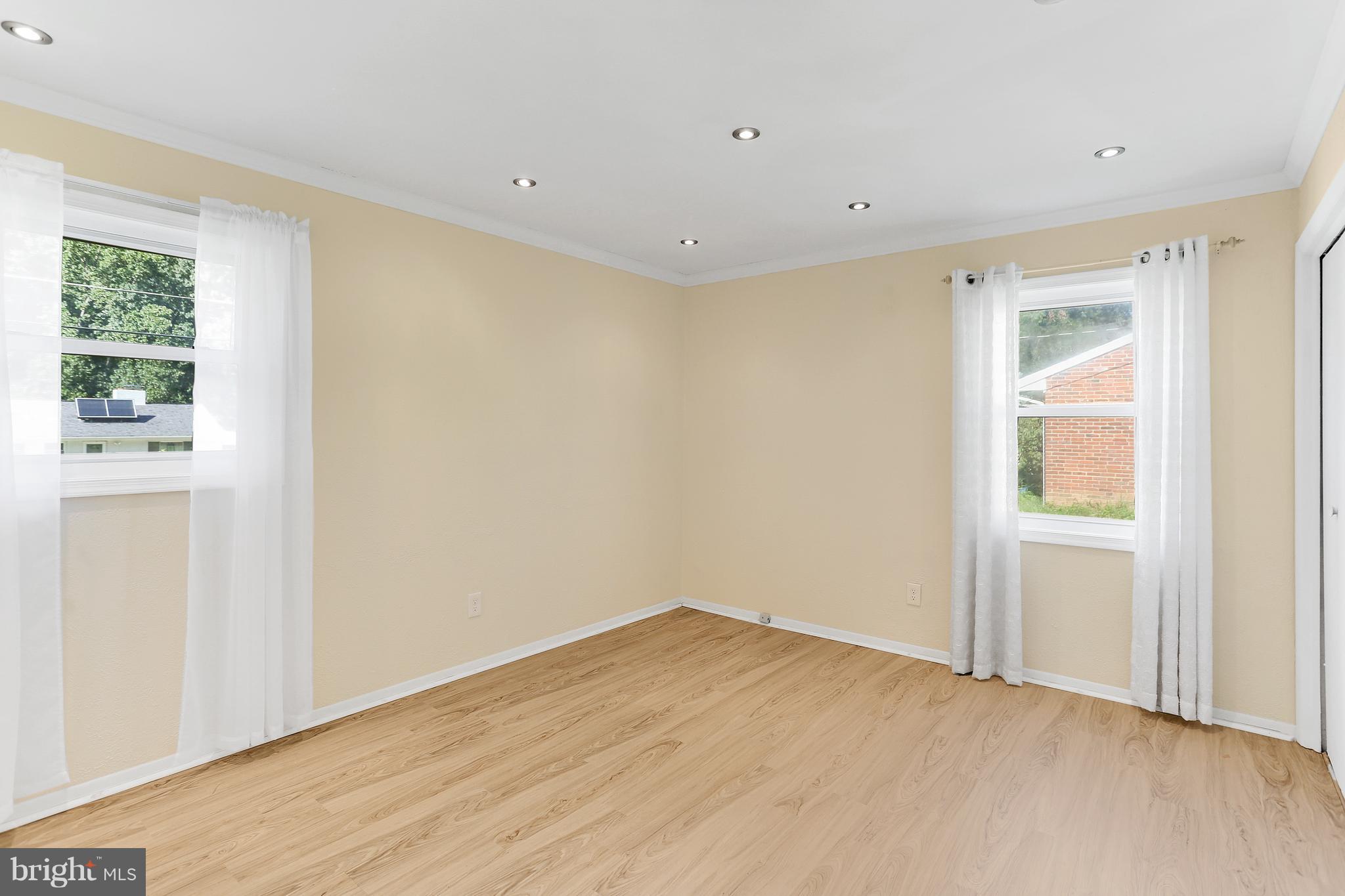7127 Dalhouse Street Springfield, VA 22151 - Photo 12 of 30 Owner's Bedroom with Recessed Lighting on Remote