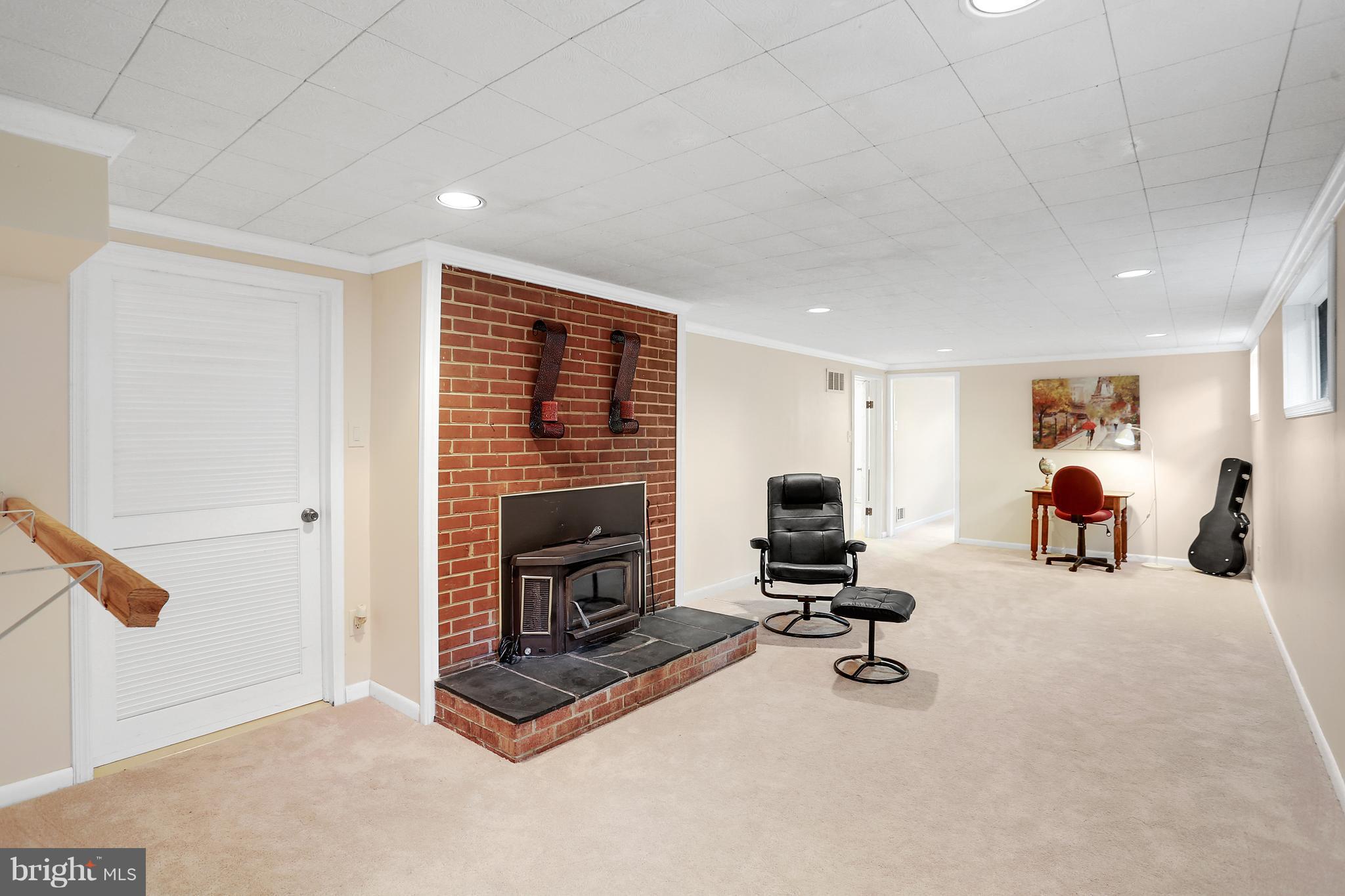 7127 Dalhouse Street Springfield, VA 22151 - Photo 18 of 30 Recreation Room w/Wood Stove and Upgraded Carpet