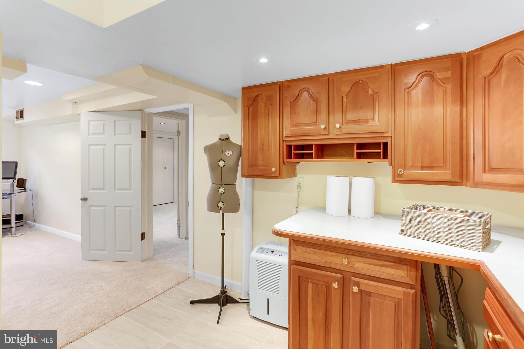 7127 Dalhouse Street Springfield, VA 22151 - Photo 24 of 30 Laundry Room - Cabinetry and Counters