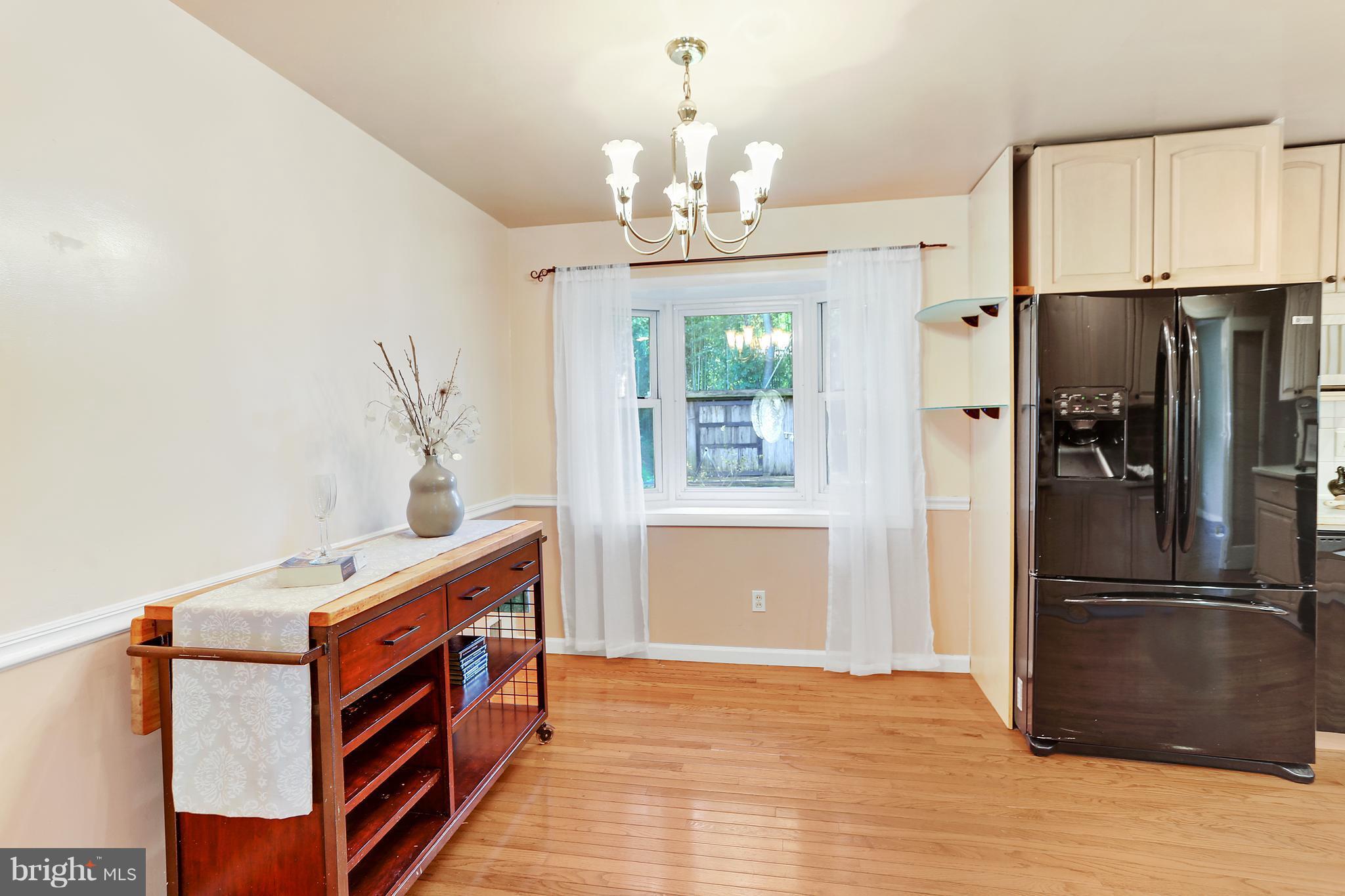 7127 Dalhouse Street Springfield, VA 22151 - Photo 7 of 30 Spacious Dining Room Open to Kitchen