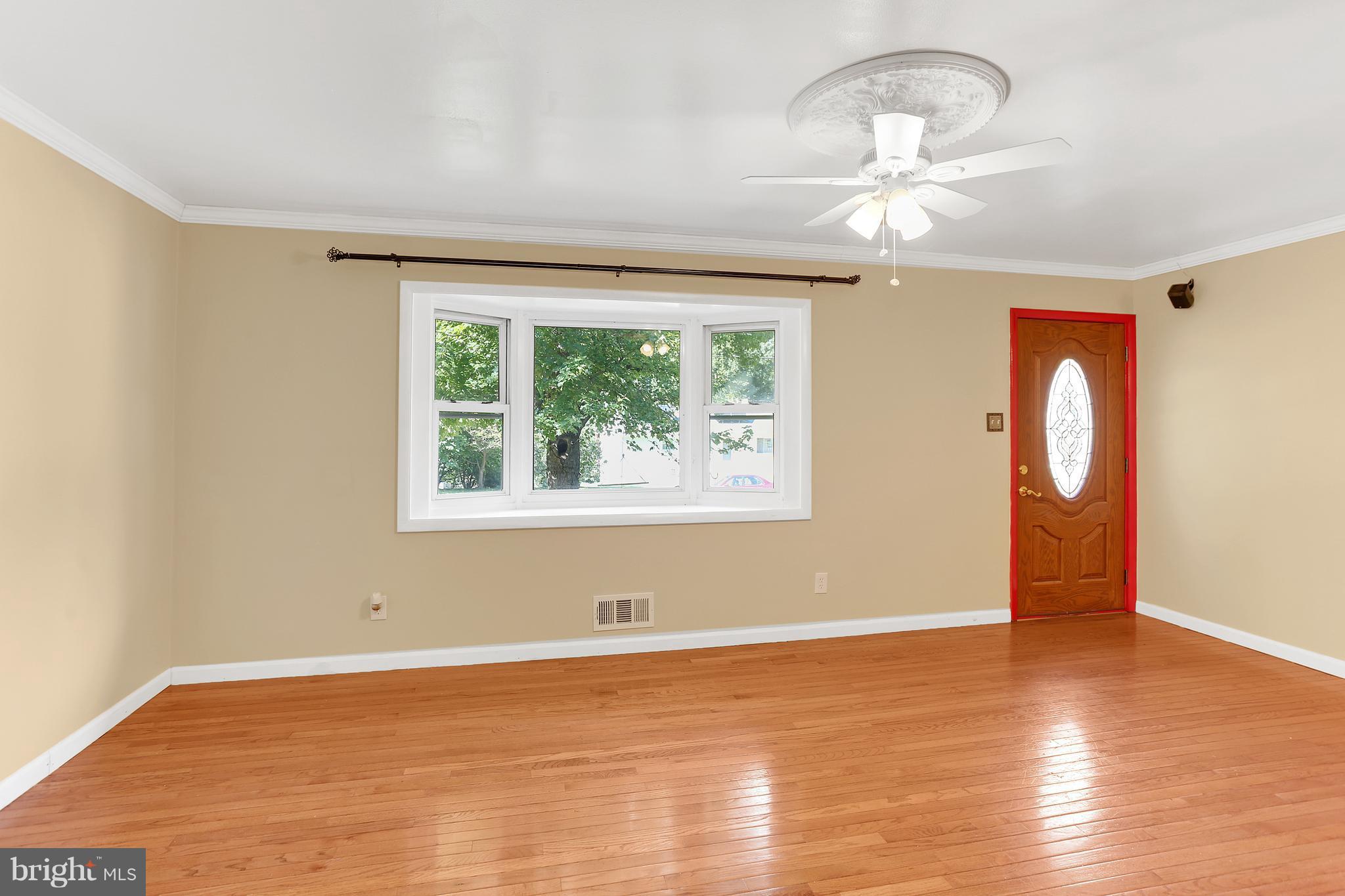 7127 Dalhouse Street Springfield, VA 22151 - Photo 9 of 30 Spacious Living Room with Hardwood Flooring