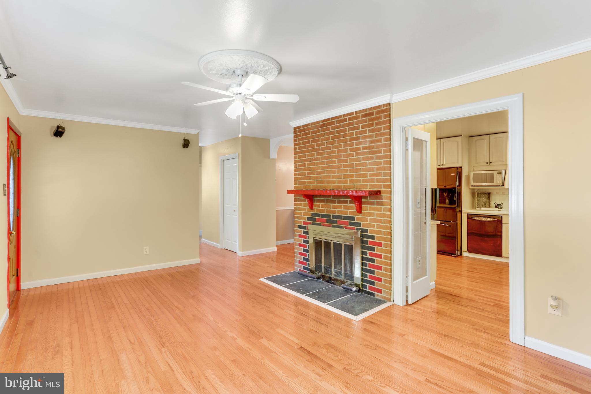 7127 Dalhouse Street Springfield, VA 22151 - Photo 10 of 30 Wood Burning Fireplace / French Doors to Kitchen