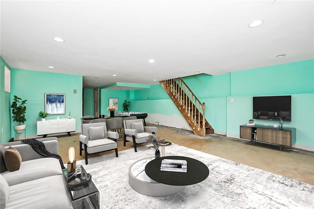 43 Reeve Place Brooklyn, NY 11218 - Photo 14 of 18 a living room with furniture and a flat screen tv